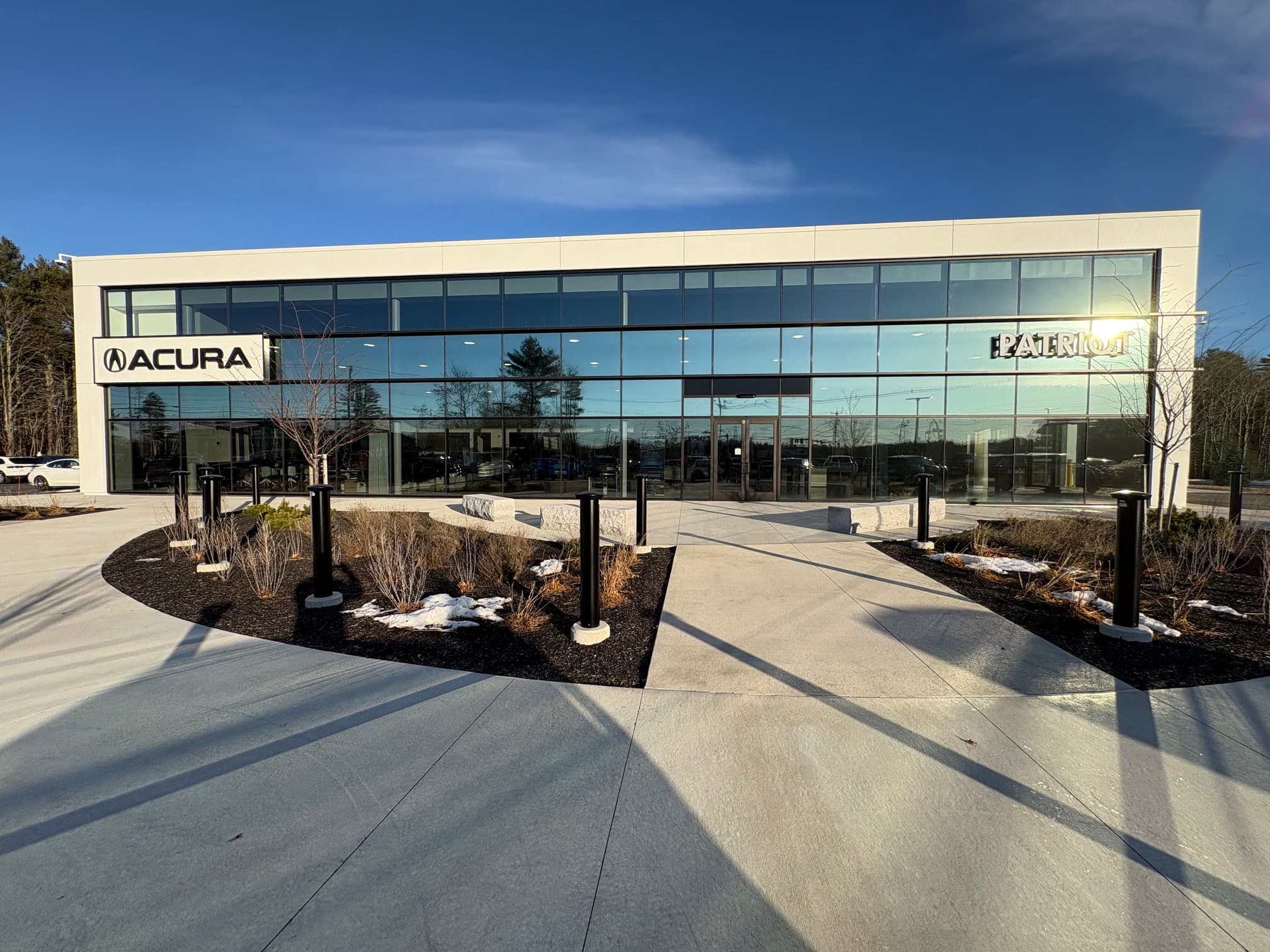 Acura dealership glass facade with commercial window film in Southern Maine